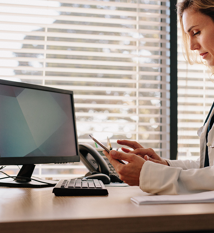 female doctor using computer